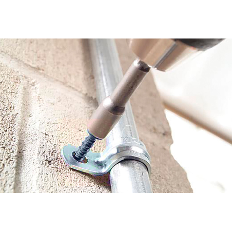 Application image of concrete screw BTS5: Metal tube is fixed to the wall with metal clip and BTS5