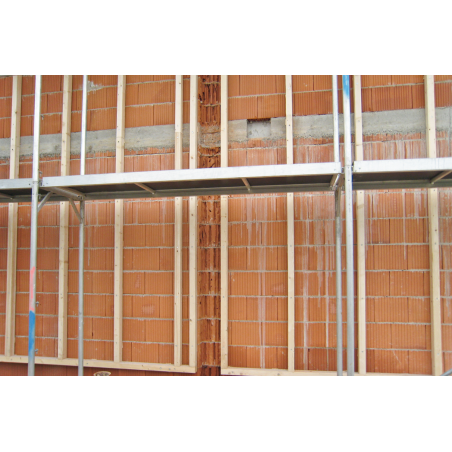 Application image of multifunction frame plug MFR: Facade substructure of wooden battens on brick wall