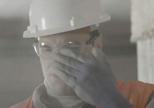 Construction worker gets dust in his eyes
